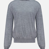 The KHAITE Annette Draped Collar Sweater is a long-sleeve, light grey turtleneck with a loose fit and ribbed cuffs and waistband, made in Italy and shown against a plain white background.
