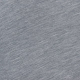 A close-up of the Annette Draped Collar Sweater by KHAITE shows its grey heathered fabric with subtle horizontal lines and a soft, woven texture.