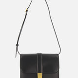 The KHAITE Blake Leather Crossbody Bag highlights Italian craftsmanship with sleek black leather, a gold rectangular flap clasp, and a single adjustable strap. Its minimalist, elegant design stands out against a plain white background.