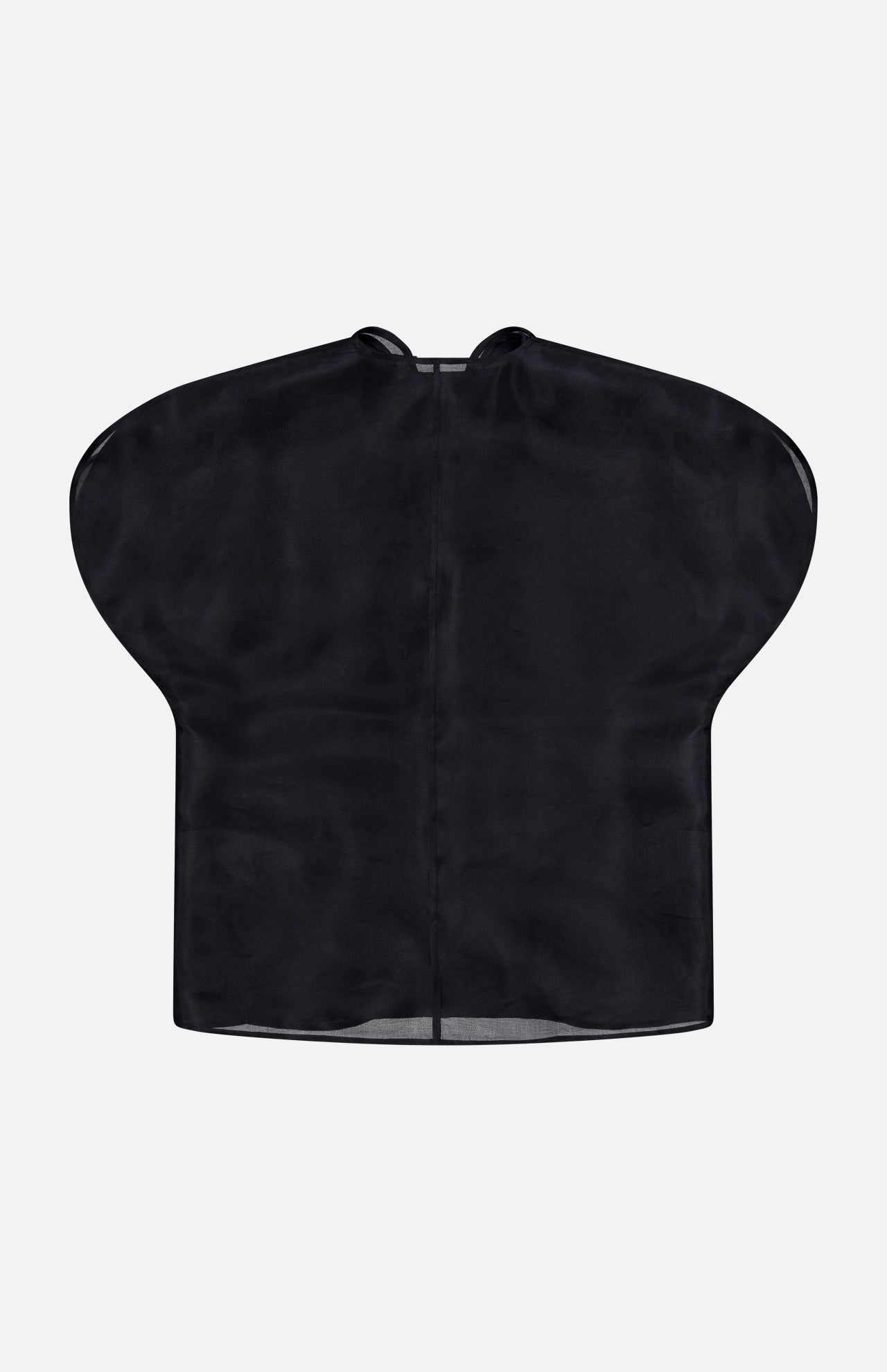 A black Briar Notch Neck Silk Blouse by KHAITE lies flat against a plain light background, its wide shoulders and center seam visible—a piece that embodies quiet luxury with its refined silhouette.