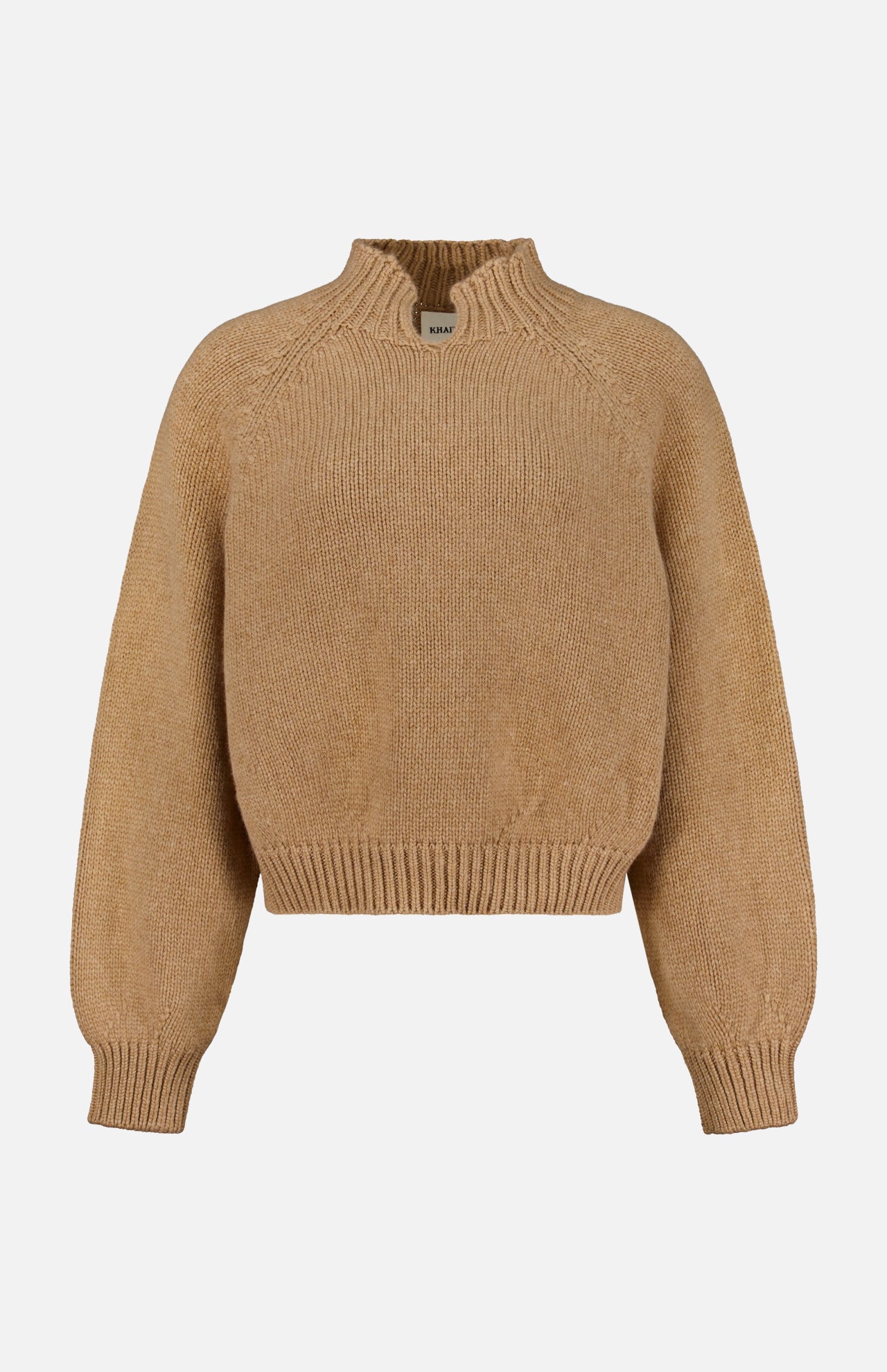 The KHAITE Cain Split Neck Cashmere Sweater, shown in tan with long sleeves and ribbed cuffs, hem, and collar, is crafted in Italian cashmere and displayed against a plain white background—an ideal addition to any minimalist wardrobe.