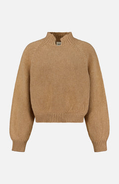 The KHAITE Cain Split Neck Cashmere Sweater, shown in tan with long sleeves and ribbed cuffs, hem, and collar, is crafted in Italian cashmere and displayed against a plain white background—an ideal addition to any minimalist wardrobe.