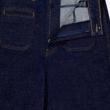 The KHAITE Delmonico Wide Leg Jean in Benson, a dark wash high-waisted style with orange stitching, is shown laid flat from above and partially unzipped to display the inside waistband and pocket details.