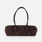 The KHAITE Donna Soft Handbag, expertly crafted in Italy from dark brown suede and featuring long double handles, is displayed against a plain white background.