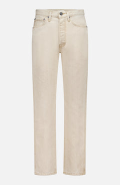 The KHAITE Finley Jean in Dumas is a pair of straight-leg, mid-rise beige jeans in stretch-free denim with five pockets, belt loops, and a button fly, shown against a white background.