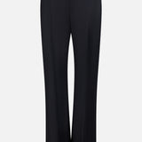 The Grenare Straight Leg Pant by KHAITE features a tailored fit with a straight-leg cut, detailed with belt loops and a clean, minimal design crafted from premium black wool. Made in Italy and shown against a white background.