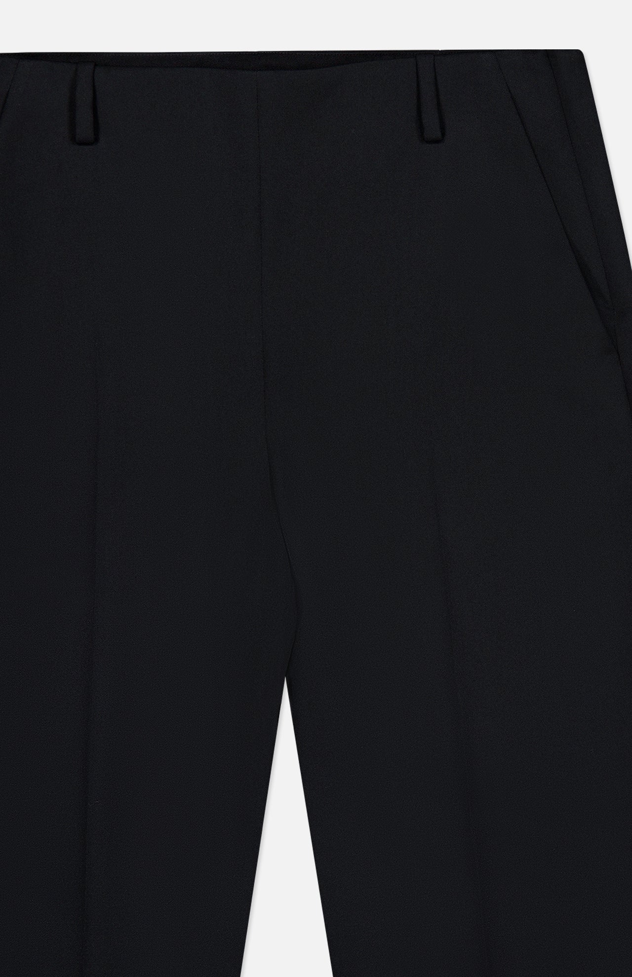 Close-up view of the KHAITE Grenare Straight Leg Pant, highlighting the tailored waistband, belt loops, and side pockets. The black wool trousers are neatly pressed with defined crease lines down the front.