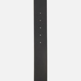 The Keefe Dome Buckle Belt 35MM by KHAITE is a black leather belt with a pointed end and five linear adjustment holes. Made in Italy.