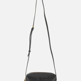 The KHAITE Kye Mini Crossbody Bag in black patent leather features a long adjustable strap, gold-tone hardware, and a small padlock detail, shown against a plain white background.