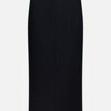 The KHAITE Lyle Column Skirt, a black knee-length pencil skirt with a straight, tailored fit, is ideal for minimalist wardrobes and is displayed against a white background.