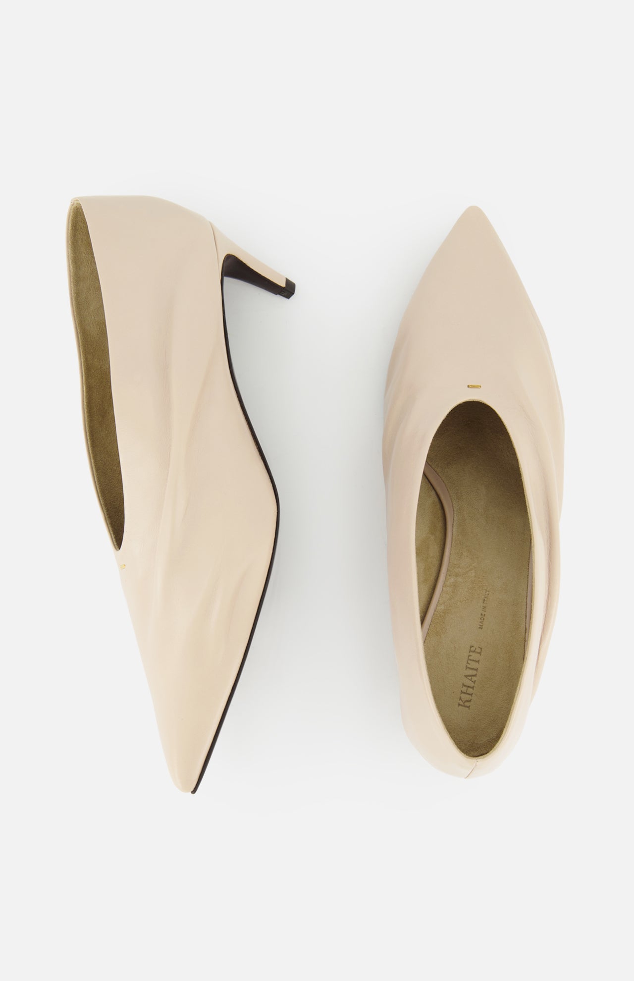 The KHAITE Miriam Glazed Leather Pump 50 is shown in nude leather, with one side view highlighting its slim pointed toe heel and another top view showing the minimalist insole—ideal for a sleek, modern wardrobe.