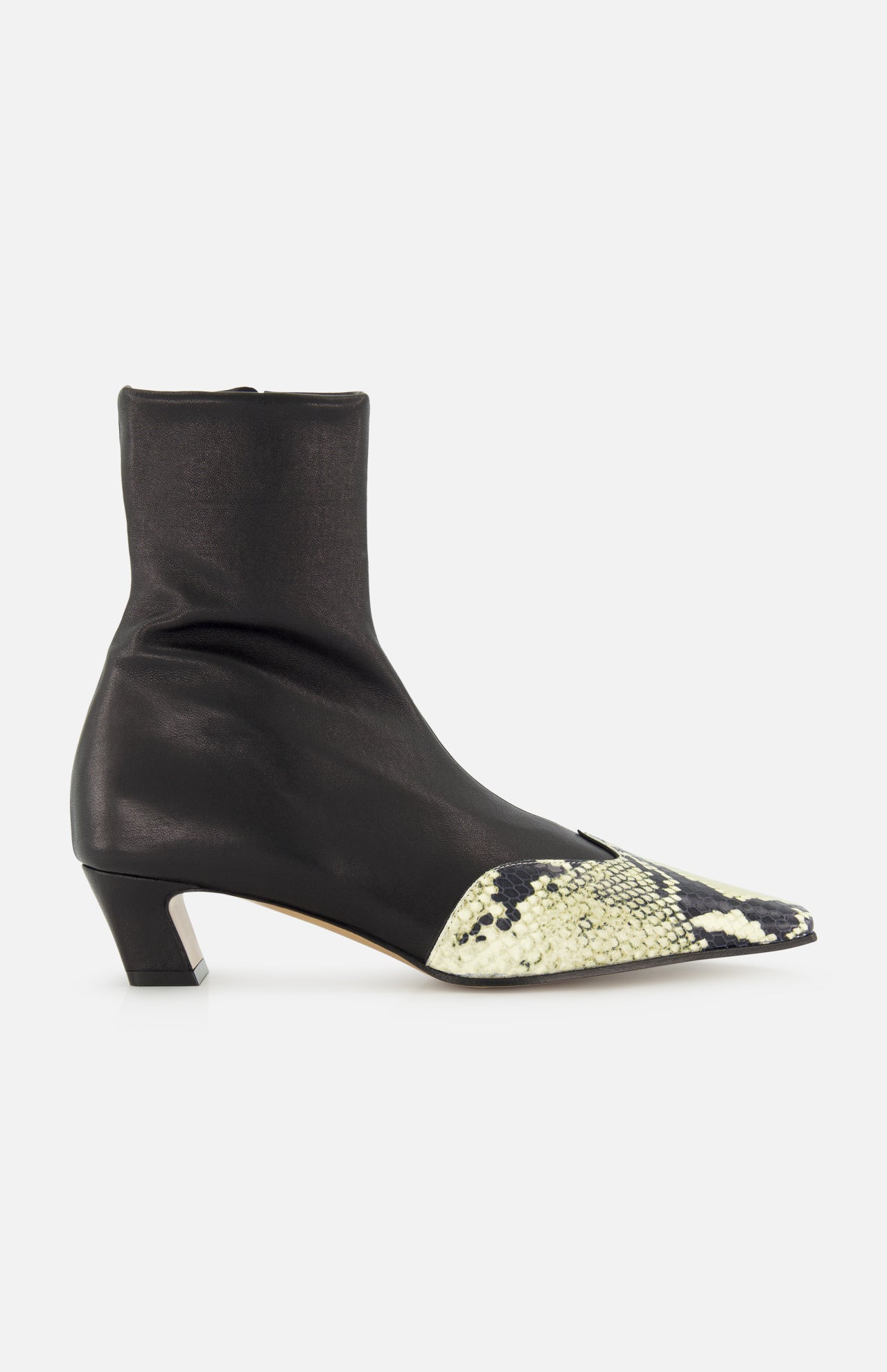 The KHAITE Nevada Ankle Stretch Boot in Python is a sleek black mid-calf boot with a low heel and pointed toe, highlighted by a contrasting light snakeskin pattern for added style.