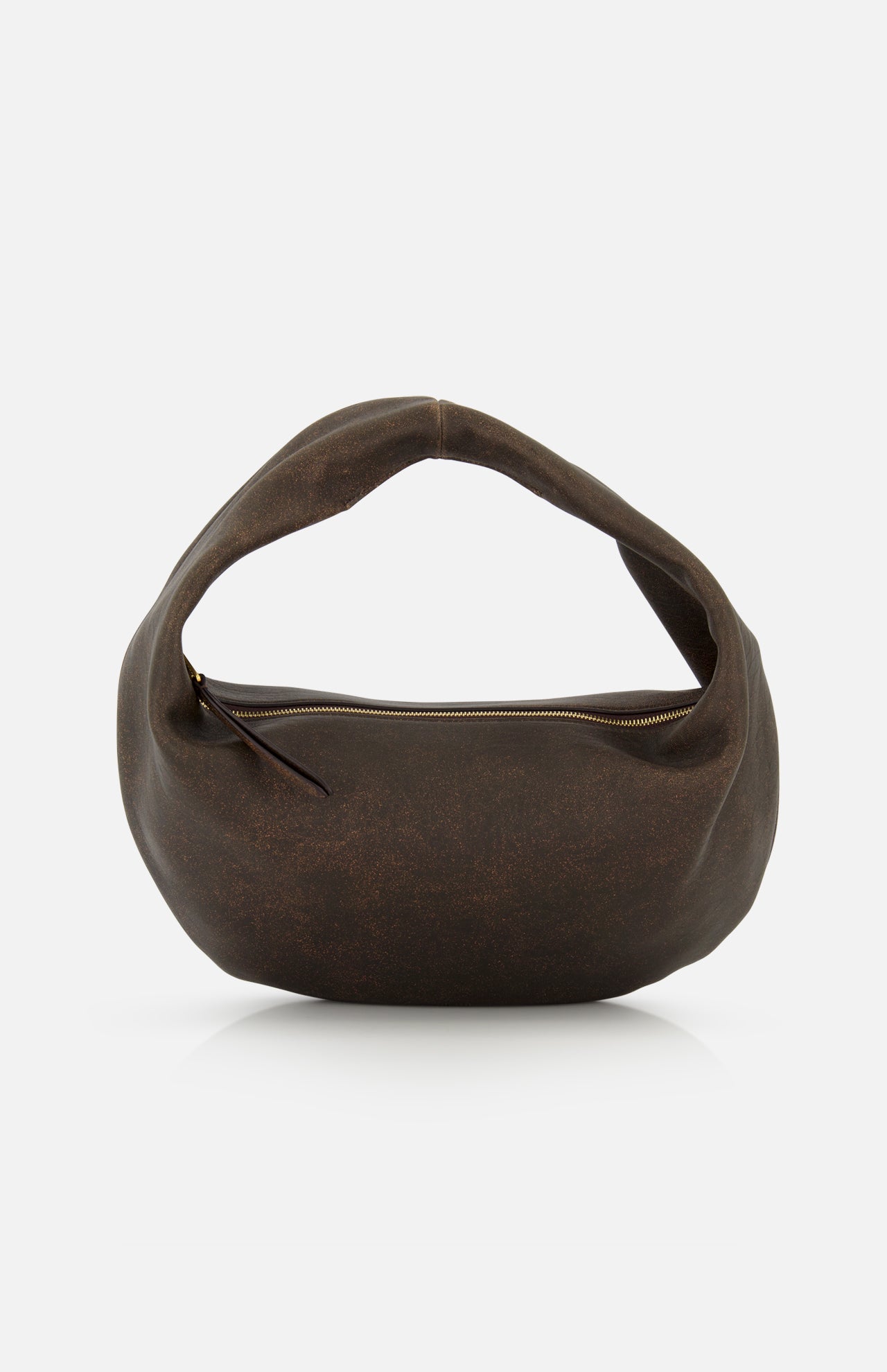 The KHAITE Olivia Hobo Medium Shoulder Bag is a brown, crescent-shaped shoulder bag crafted from distressed leather, featuring a curved handle and an exposed gold zipper. It is shown against a plain white background.