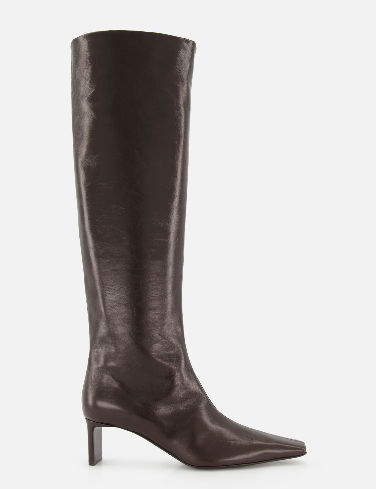 Introducing the Ona Knee High Boot by KHAITE: a tall, dark brown leather boot handcrafted in Italy, showcasing a knee-high silhouette with a pointed toe and a low, slender heel, photographed against a white background.
