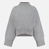 The Phelps Cashmere Sweater by KHAITE—a light gray, long-sleeve cropped knit—features a ribbed mock neck, cuffs, and hem, making it an ideal choice for a minimalist wardrobe. Displayed against a plain white background.
