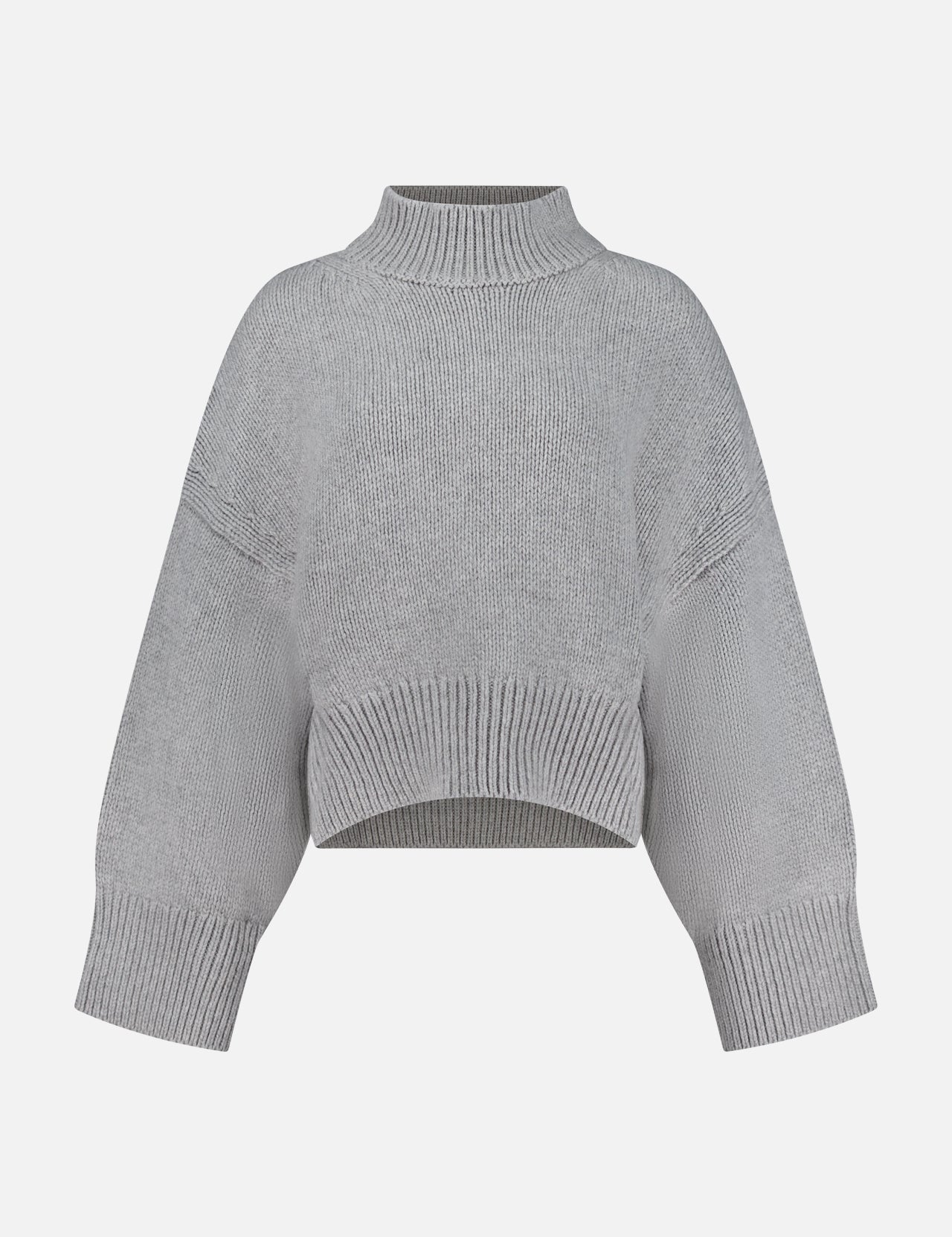 The Phelps Cashmere Sweater by KHAITE—a light gray, long-sleeve cropped knit—features a ribbed mock neck, cuffs, and hem, making it an ideal choice for a minimalist wardrobe. Displayed against a plain white background.