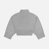 The KHAITE Phelps Cashmere Sweater is displayed flat against a white background, showcasing its gray hue, long sleeves, cropped silhouette, high neckline, ribbed cuffs, and waistband—making it a refined choice for any minimalist wardrobe.