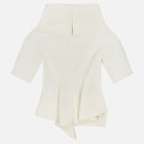 The Pippa Peplum Top by KHAITE is a white, off-the-shoulder cream top featuring short sleeves, an asymmetrical hem, and a back zipper, shown on a plain white background.