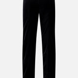 The Ryden Velvet Pant by KHAITE is a pair of high-rise black velvet pants made in Italy, shown from the back with straight legs and a simple design, set against a plain white background.