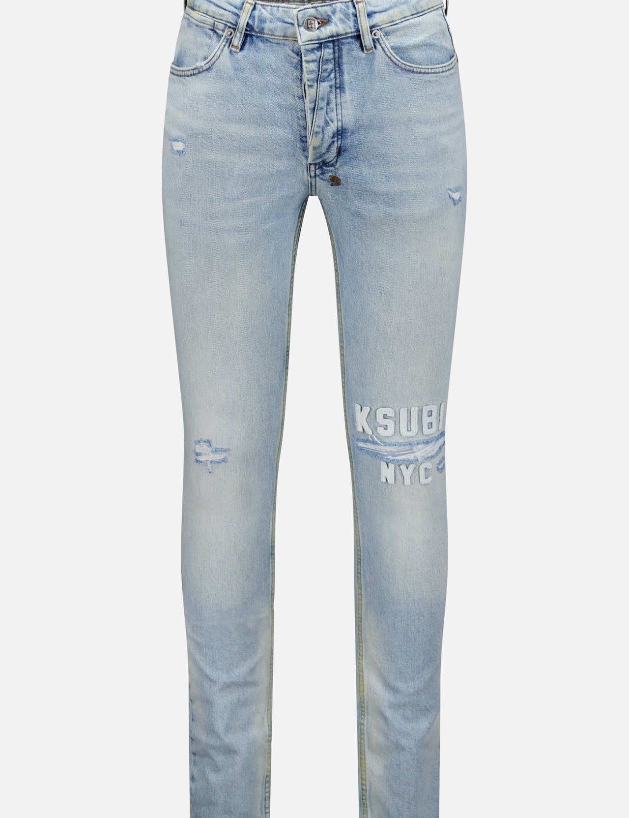 The KSUBI Kasper Van Wrinkle Jeans are light blue, mid-rise skinny jeans in stretch denim with rips and distressing, “KSUBI NYC” printed in white on the left thigh, classic pockets, belt loops, and a button fly.