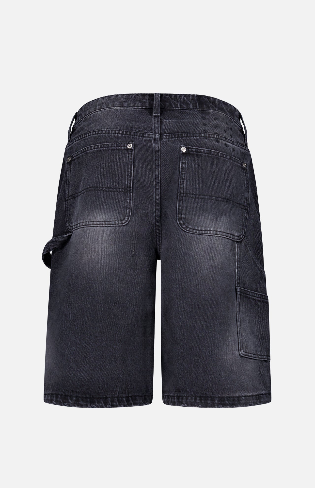 Back view of KSUBI Maxx Operator Jean Shorts in black denim featuring wide legs, two large back pockets, a carpenter pocket, and a left-side hammer loop, shown against a plain white background.