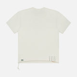 Back view of the KSUBI Prestige Biggie Short Sleeve T-shirt in antique white premium cotton, featuring an oversized fit, a left-side drawstring at the hem, and small black print details near the lower right hem.