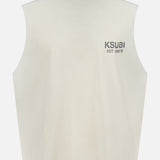 The KSUBI State Halen Cut Off T-shirt is an off-white, oversized sleeveless tee with a high crew neck, "KSUBI EST. 1999" in gray on the chest, a boxy fit, and a small drawstring at the right hem.