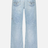 The KSUBI Toro Western Knee Paneling Jeans are shown from the back in a light blue denim wash, featuring two rear pockets with stitching detail and lightly faded fabric inspired by classic western jeans for a timeless look.
