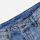 Close-up of the waist area of KSUBI’s Van Winkle Duke 4Eva Jeans in blue, highlighting the button, belt loops, and front pocket details, expertly crafted from comfort stretch denim against a white background.