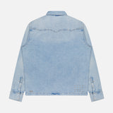 The KSUBI Whiplash Long Sleeve Western Shirt is shown from the back in light blue denim, featuring long sleeves, buttoned cuffs, and classic western-inspired yoke detailing. It has a straight hem and a slightly faded, worn-in look.