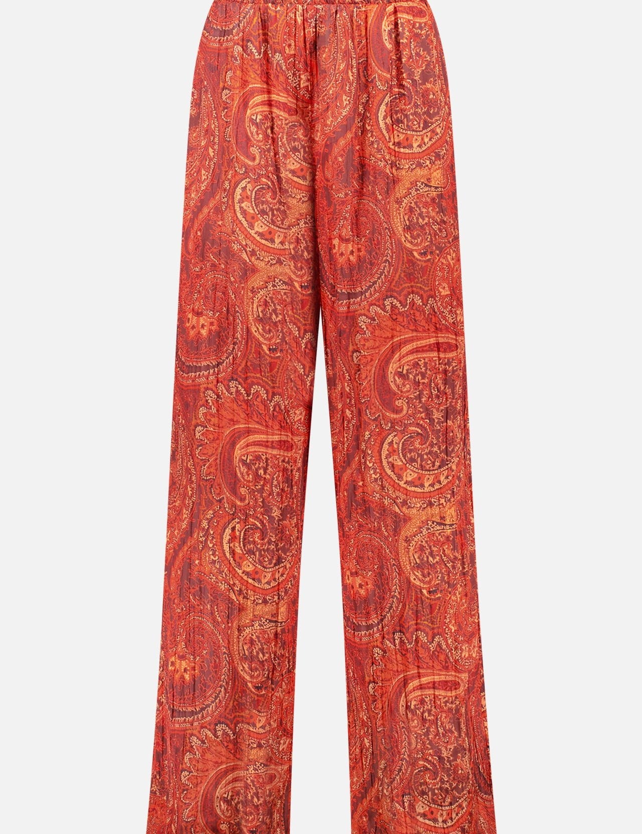 The L'AGENCE Lillian Wide Leg Pant features a loose fit, elastic waistband, and crinkled satin fabric with a burnt orange paisley pattern in gold tones on white.