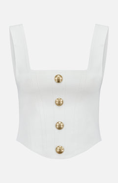 The Saga Knit Button Top by L'AGENCE is a white power knit corset top with a square neck, sleeveless design, and five large round gold embossed buttons down the structured front.