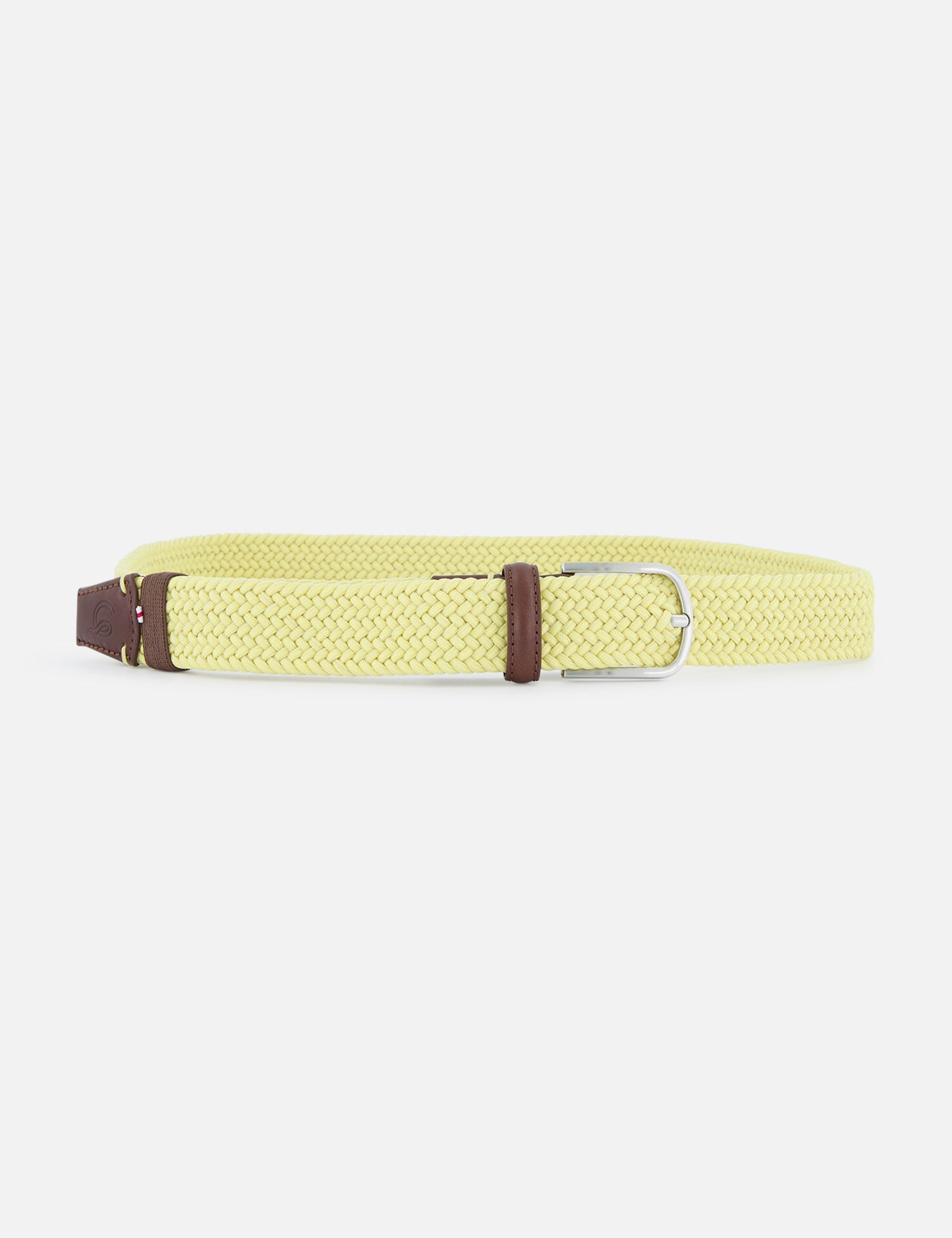 The Ibiza Belt by LA BOUCLE is a thin, elastic braided yellow leather belt with a silver buckle and brown accents, designed as a stylish one-size-fits-all accessory. Presented on a plain white background.