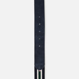 A close-up of the LA BOUCLE Princeton Hybrid Smart Belt shows its navy blue color, suede tip, five holes, and a striped fabric section in navy, white, and green.