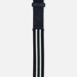 The Princeton Hybrid Smart Belt by LA BOUCLE features navy stretch material with white and green stripes, a silver buckle, and a small metal tag near the tip.