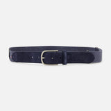 The Palm Beach Hybrid Smart Belt by LA BOUCLE features navy blue suede, a silver rectangular buckle, multiple adjustment holes, and a matching loop. Its one-size-fits-all design is showcased on a plain white background.
