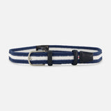 The LA BOUCLE Bristol Chevron Club Belt, featuring blue and white stripes, black leather accents, and a silver buckle, is displayed on a plain light background.