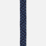 The Manhattan Belt by LA BOUCLE features a woven stretch design in blue tones, chevron pattern, and a dark blue leather tip.