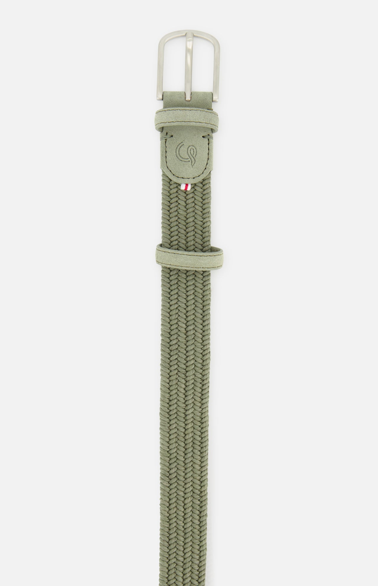 The Veneto Suede Waxed Cotton Belt by LA BOUCLE is sage green with a silver buckle, suede leather tip, embossed logo, and a stitched tricolor tag.