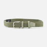 The LA BOUCLE Veneto Suede Waxed Cotton Belt is a light olive green stretch belt with a silver buckle, matching loop, and zero hole-design, shown on a white background.