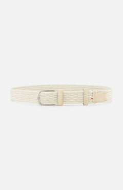 The LA BOUCLE Toscana Suede Belt is a beige stretch belt with a silver rectangular buckle and light tan leather accents, shown on a white background. This one-size-fits-all accessory combines style, comfort, and versatility.