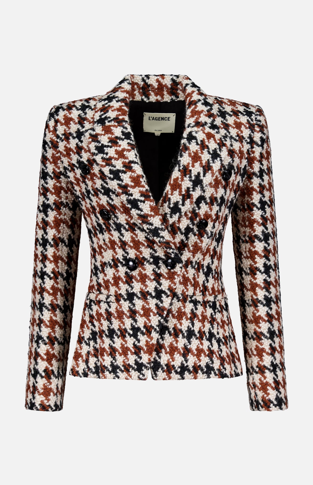 The Marie Double Breasted Houndstooth Blazer by L'AGENCE features a notched lapel, cinched waist, and brown, black, and white houndstooth pattern. Shown against a plain light gray background.