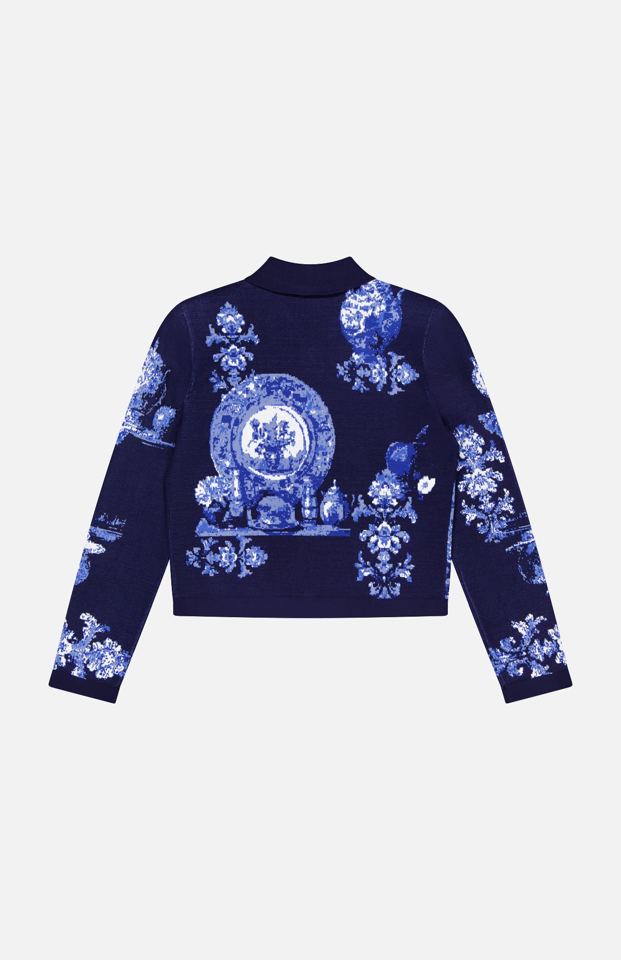 The Osiris Jacquard Collared Cardigan by L'AGENCE is a navy blue top adorned with light blue and white porcelain-inspired plate, vase, and floral motifs on the back and sleeves.