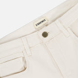 Close-up of the waistband on the cream Ruth High Rise Straight Jean by L’AGENCE, featuring premium stretch denim, a metal button, belt loops, coin pocket, and an interior L’AGENCE label.