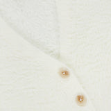 Close-up of the Agathe Fuzzy Collared Cardigan by L’AGENCE, featuring soft fuzzy white fabric and three light brown buttons.