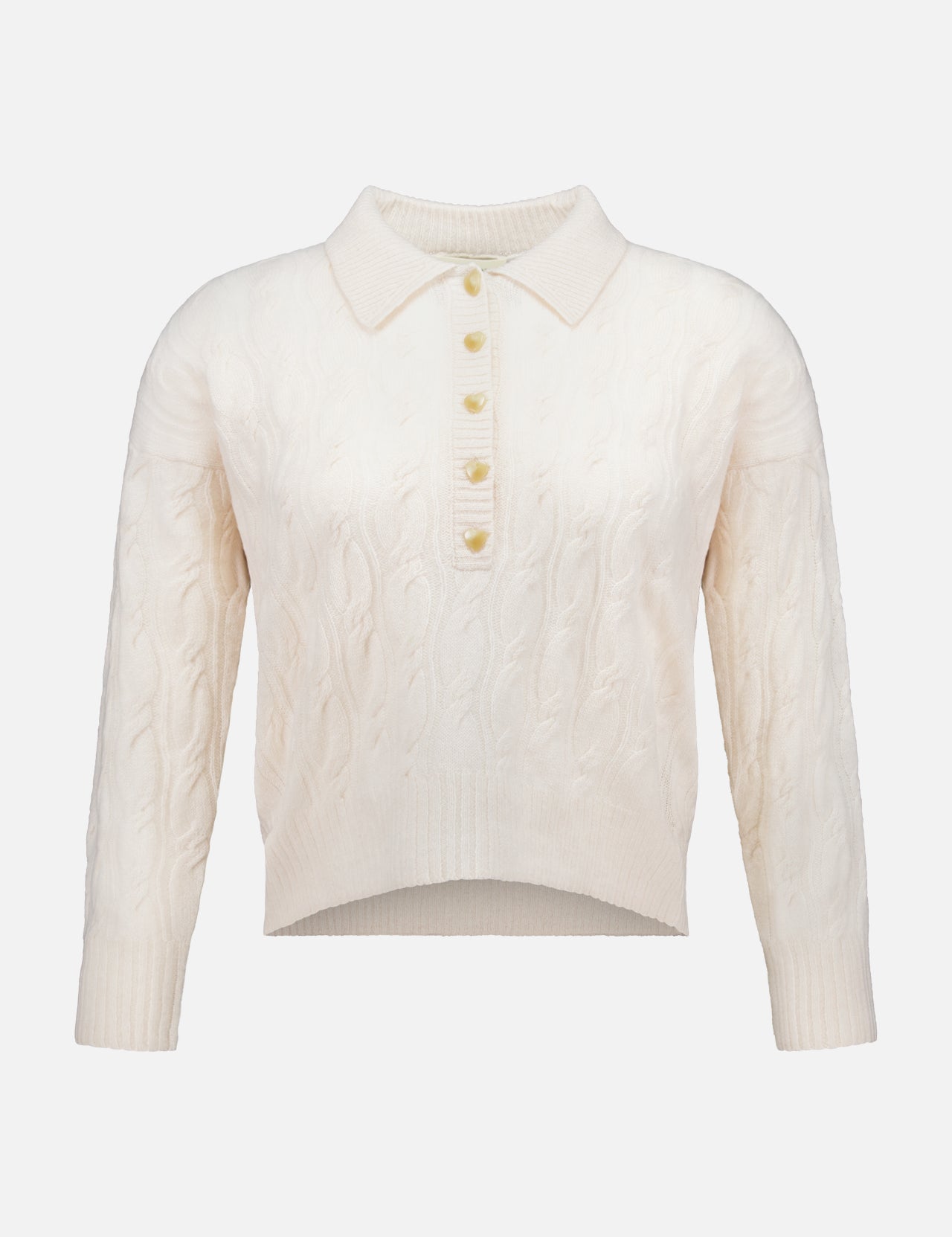 The Airy 3/4 Sleeve Heart Button Sweater by L’AGENCE features a cream cable knit design with a collared neckline and a partial button-down front adorned with five heart-shaped buttons. This vintage-inspired, long-sleeve sweater boasts a slightly cropped, uneven hem for a blend of timeless appeal and modern style.