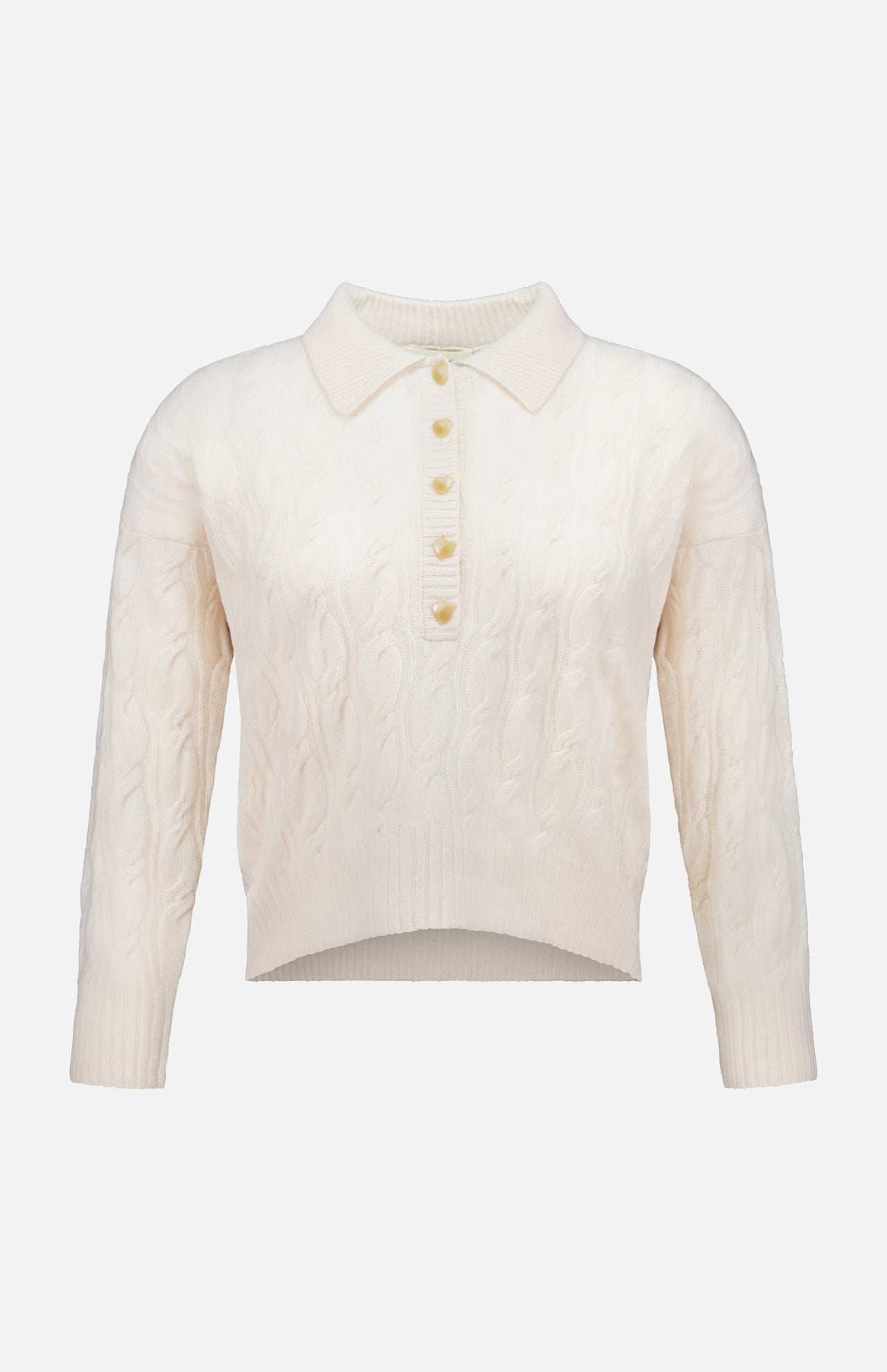 The Airy 3/4 Sleeve Heart Button Sweater by L’AGENCE features a cream cable knit design with a collared neckline and a partial button-down front adorned with five heart-shaped buttons. This vintage-inspired, long-sleeve sweater boasts a slightly cropped, uneven hem for a blend of timeless appeal and modern style.