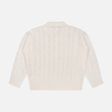 The Airy 3/4 Sleeve Heart Button Sweater by L’AGENCE is a vintage-inspired ivory piece in a classic cable knit, featuring three-quarter sleeves and heart-shaped buttons; shown from the back, it’s laid flat on a white background.