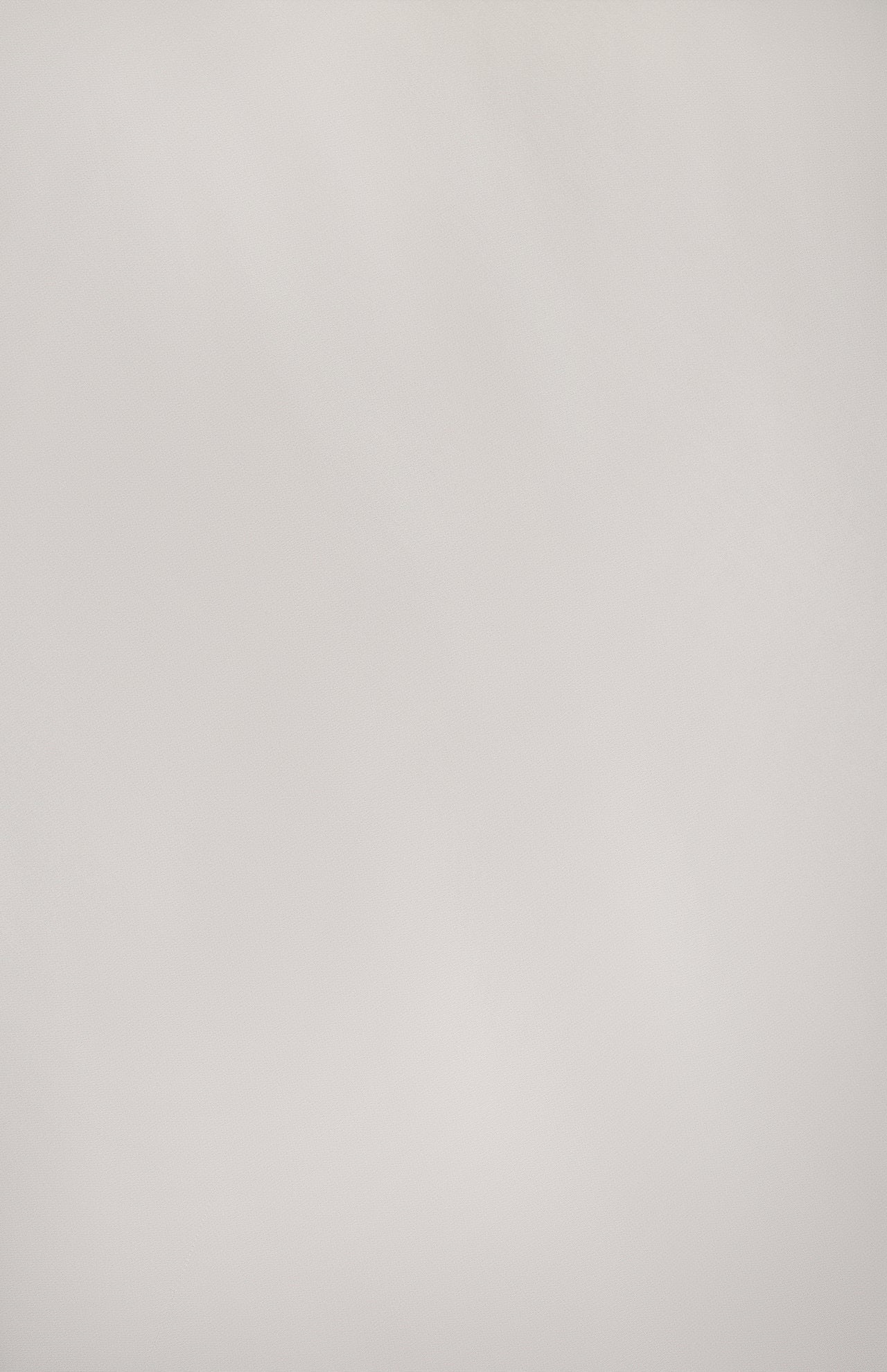 A smooth, light gray textured surface with subtle shadows provides a minimalistic background—ideal for highlighting the L'AGENCE Akiya Contrast Tank Dress or other sleek styles.