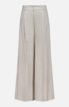 The Allanah Mid Rise Trouser Pant by L'AGENCE features wide legs, a tan pinstripe pattern with thin vertical brown stripes, front pleats, and belt loops, shown on a plain white background.